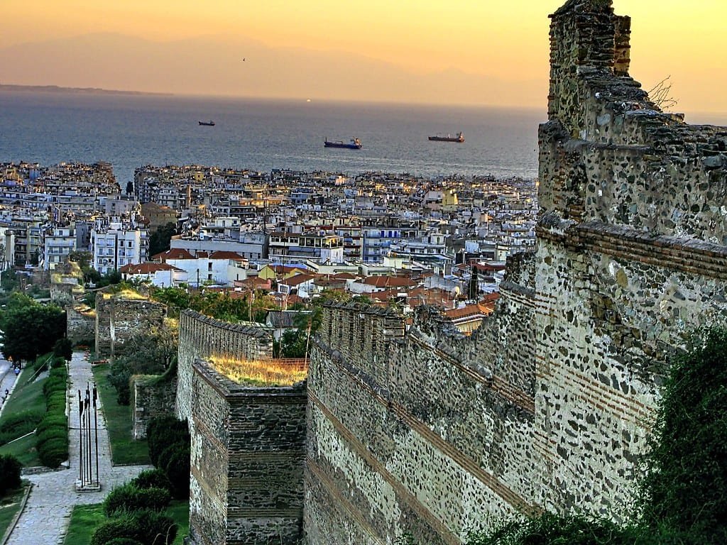 Stone and brick Eastern Walls of Thessaloniki overlooking the city and the sea at sunset