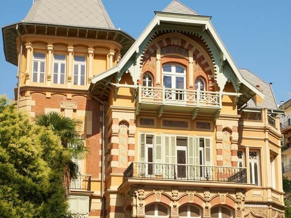 Ornate mansion in Hamidiye featuring a turret, decorative gables, and balconies with European architectural influences